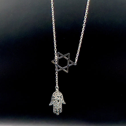 Star of David and Hamsa Drop Necklace - Simply Just Deals LLCStar of David and Hamsa Drop NecklaceJewelry Pendant Necklace42560115703831GoldThe Star of David and Hamsa Drop Necklace features a gold plated chain with a Star of David pendant and a delicate filigree Hamsa hand charm, beautifully set against a black background.