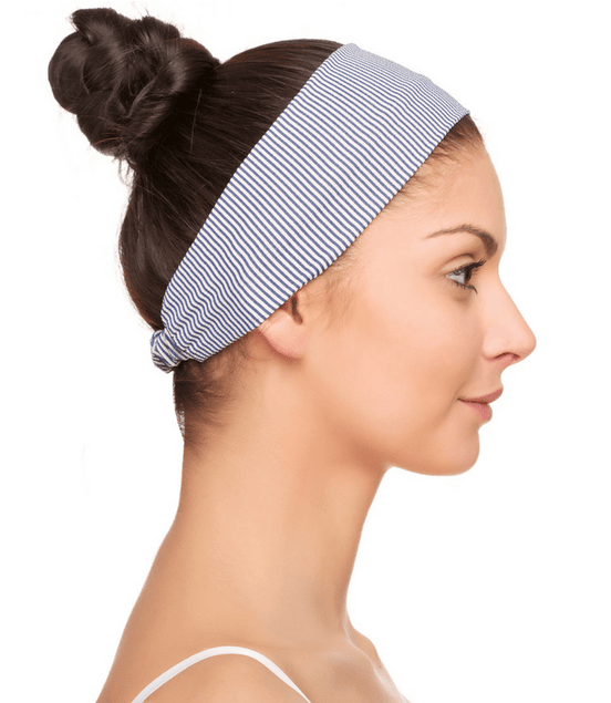 Striped Headband Lauma Navy - Simply Just Deals LLCStriped Headband Lauma NavyHeadbandLM82E01One SizeNavy Blue WhiteA woman with dark hair in a bun, wearing the Striped Headband Lauma Navy and a white strap top, is shown in profile against a white background.